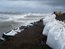 Sandbags sit stacked along the seawall in Kivalina, Alaska, in September 2007. The island town has accused a handful of mostly U.S. energy companies of contributing to global warming though greenhouse gas emissions, which it says has rendered the town uninhabitable. (Associated Press)
