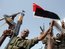 Members of the Sudanese armed forces raise their weapons during a visit by President Omar al-Bashir in Heglig, Sudan, on Monday, April 23, 2012. (AP Photo)